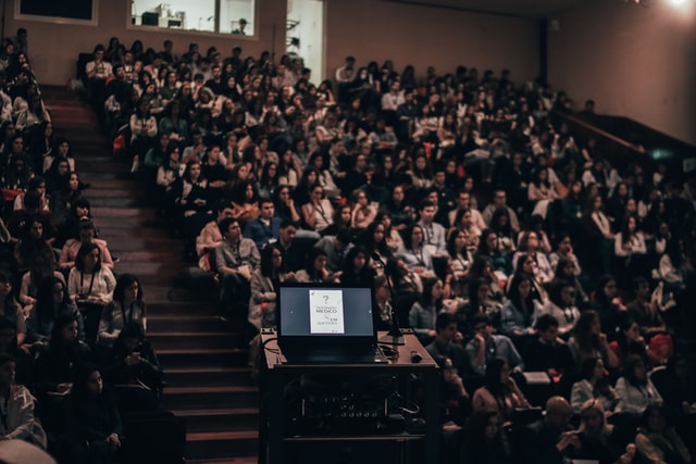 students sitting inside a lecture hall