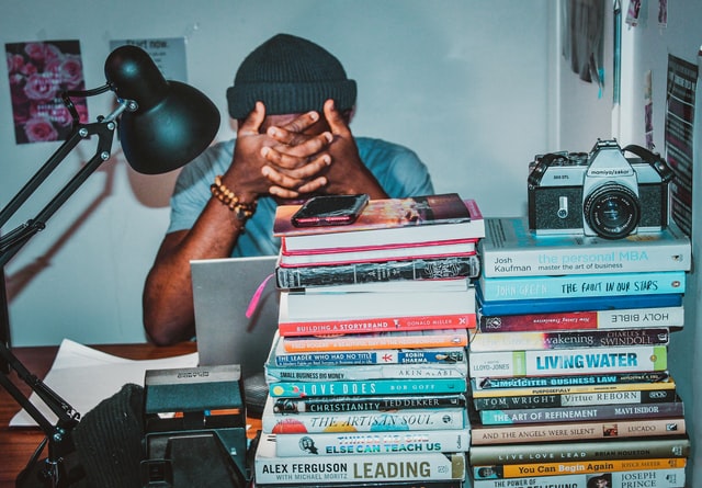 a student studying with books on the table