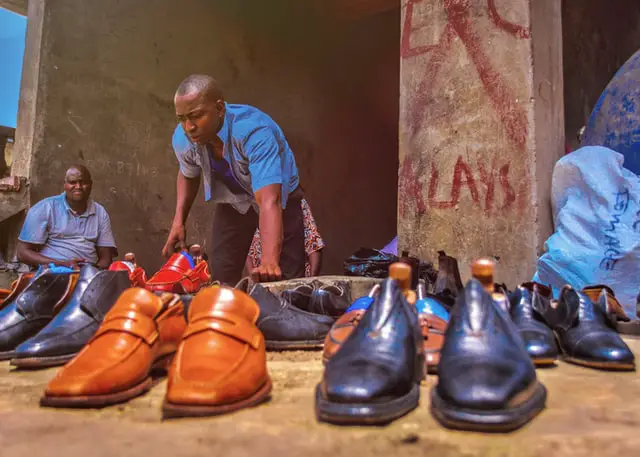 Nigerian man selling shoes
