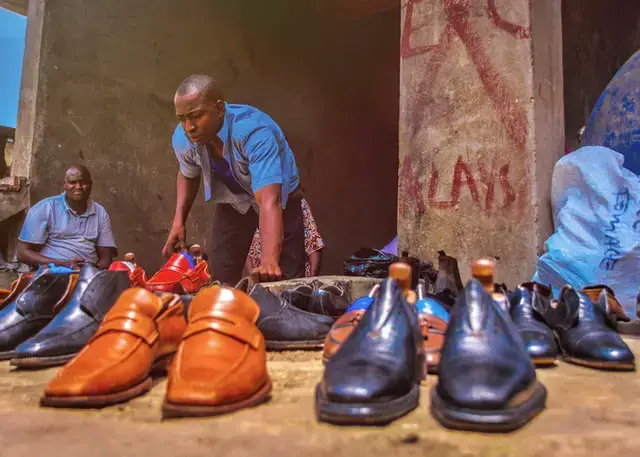 Nigerian man selling shoes