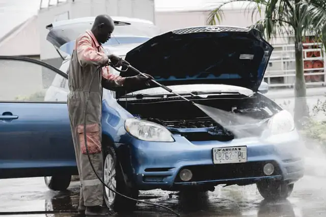 Nigerian man washing car