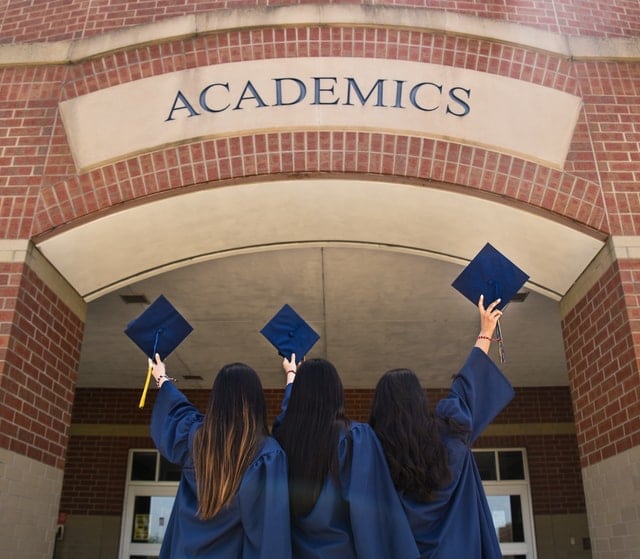 students wearing graduation gown