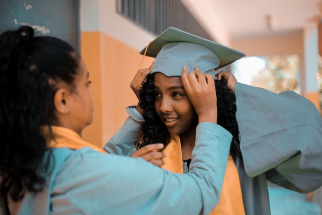 woman wear convocation gown