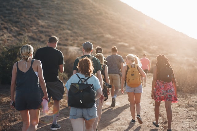 People walking on dirt road