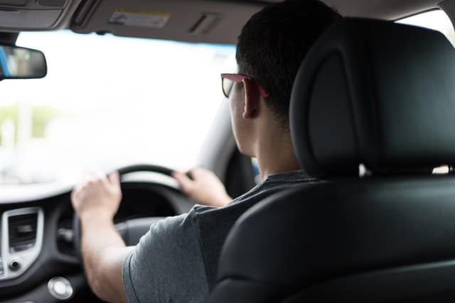 Picture of a man driving a car