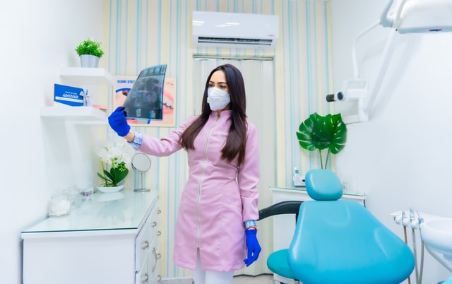 Woman viewing x-ray film