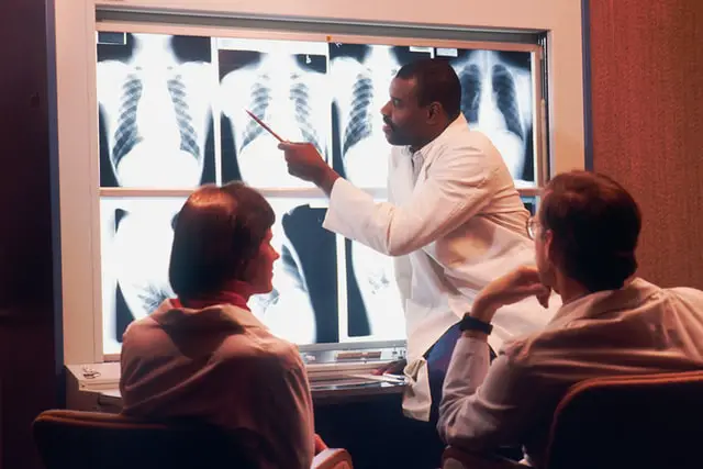 Radiologist examining a x-ray film
