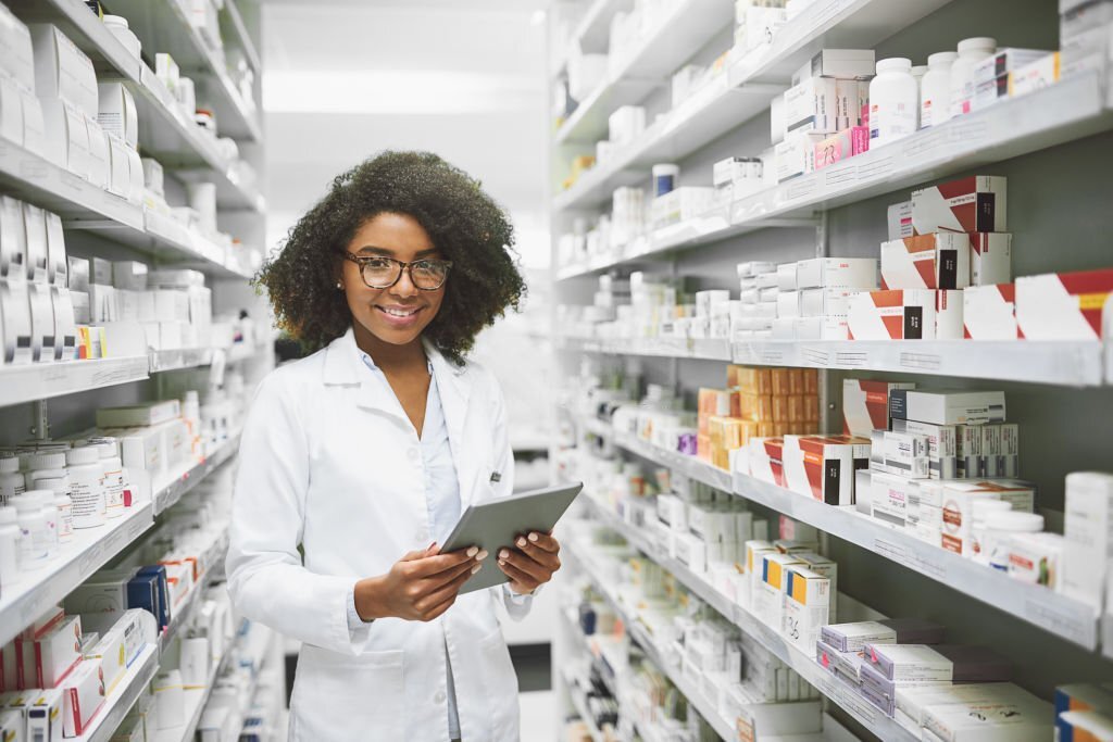 A pharmacist standing