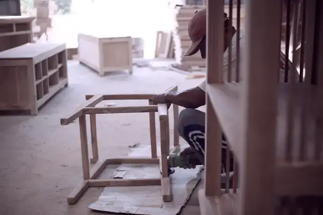 Carpenter making a wooden chair