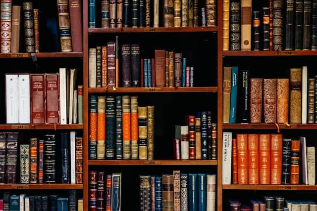 books piled in a shelve