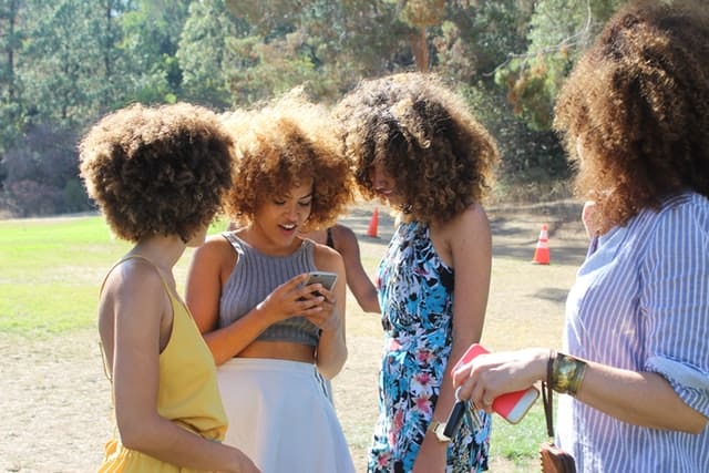 women holding phone